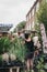 People buying plants and flowers at the Columbia Road Flower Market, London, UK.