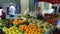 People buying at street market flowers fruits and vegetables in Aix-en-Provence France