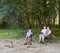 People camping in forest, family active in nature, kindle fire, summer season