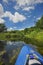 People canoe in the river in summer. First-person view