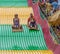 People on carnival slide at state fair