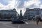 People, cars and monument to Alfred Escher on Bahnhofplatz square