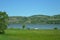 People with cars on a picnic by the river