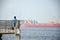 People cast the fishing rod to the sea in Punggol beach, Singapore