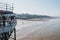 People catching crabs with buckets lowered from Cromer pier, Norfolk, UK