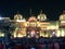 people celebrate the Namaste Orchha festival with illuminated temple and houses nearby