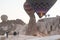 People celebrating a wedding under a hot air balloon in Cappadocia