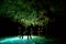 People in cenote cave with underground water system at Rio secreto, Mexico