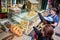 People choosing fresh pastry and bakery products in a vendor shop of old city streets of Jerusalem, Israel