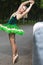 People in Choreography. Portrait of Sensual Dancing Professional Caucasian Ballet Dancer in Green Tutu Dress Posing With Lifted