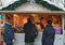 People at Christmas stall in Xmas market at Cathedral Square