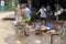 People clean their stuff in the flooded buildings