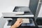 People clean touch screen of office printer for maintenance