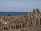 People climb on the rocks of the famous Giants Causeway in Northern Ireland - BUSHMILLS. NORTHERN IRELAND - MAY 12, 2019