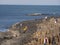 People climb on the rocks of the famous Giants Causeway in Northern Ireland - BUSHMILLS. NORTHERN IRELAND - MAY 12, 2019