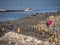 People climb on the rocks of the famous Giants Causeway in Northern Ireland - BUSHMILLS. NORTHERN IRELAND - MAY 12, 2019