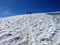 People climbing a mountain snowfield