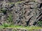 People climbing a quarry disabled rock wall