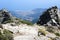 People climbing up mount Capanne on Elba island, Italy