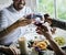 People Clinging Wine Glasses Together in Restaurant