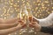 People clinking glasses of champagne on blurred background