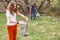 People collect garbage and plastic bottles in the forest