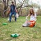 People collect garbage and plastic bottles in the forest