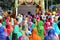 people with colorful clothes and women with veil during the reli