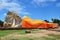 People come to Wat Lokayasutharam Temple for travel and pray Reclining Buddha