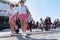 People on and coming and going from Greek Island ferry at wharf at Skiathos