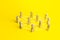 People connected by lines on a yellow background. Self-organized hierarchical business company system. Distribution