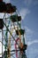 People are content riding on cheap, dilapidated and rustic ferris wheel ride in a small town festivity