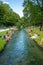 People cool off their feet in a stream