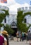 People in costume gathered around the castle entrance including a girl dressed as a rainbow fairy at the Renassiance Festival in M