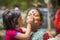 People covered in colorful powder dyes celebrating the the Dol Utsav Festival in Dhaka, Bangladesh.