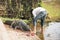 People with crocodile at the Tomb Mosque in bagerhat, Bangladesh