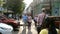 People cross the road at the traffic lights between cars at the intersection of Deribasovskaya and Ekaterininskaya streets.