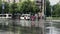 People cross the street in the rain, wet asphalt road