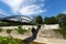 People crossing bridge with Wienfluss Vienna River flowing under at Stadtpark, City Park in Vienna, Austria