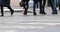 People crossing the crosswalk in the city