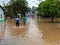 People crossing flooded streets - Capivari river overflow - Sao Paulo - Brazil