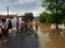 People crossing flooded streets - Capivari river overflow - Sao Paulo - Brazil