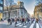 People crossing the street in front of the building of BBVA bank in Bilbao