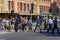 People are crossing street in front of Flinders train station building in Melbourne