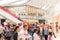 People Crowd Shopping In Luxury Mall Interior