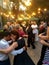 People dance a pair dance on a retro dance floor in the center of Lviv