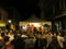 People dance on stage during Fat Tuesday, Mardi Gras Carnival