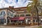 People dine on the open veranda of cafe on the resort of Lloret de Mar