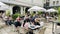 People dine on the open verandas of cafes and restaurants on the Bergs Bazaar district in Riga