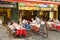 People dining in the restaurant on the street of Nice city center.